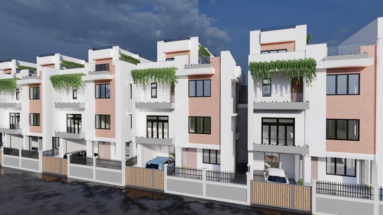 Row of contemporary townhouses with planted balconies and individual street entrances